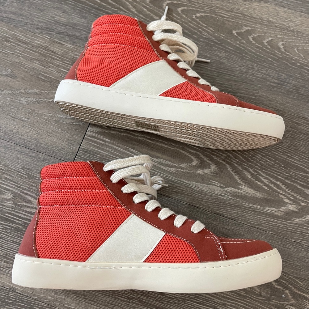 Orange and white high top shoes. Size 6.5 Never worn.